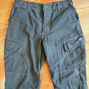 Baggy Dark green military cargo pants with adjustable waist and cuffs